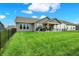 The backyard features a patio area with outdoor furniture, grilling area, and a large grassy lawn at 3592 Gillsland Rd, Bargersville, IN 46106