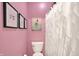 Bright bathroom boasts unique artwork, a shower/tub combination, and modern design at 3592 Gillsland Rd, Bargersville, IN 46106