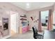 Bright bedroom with pink accents, a window, and a decorative light fixture creating a stylish space at 3592 Gillsland Rd, Bargersville, IN 46106