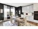 Charming dining area with natural light, modern table set, and black accent wall offering an inviting space at 3592 Gillsland Rd, Bargersville, IN 46106