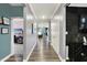 Spacious hallway showcasing stylish flooring, neutral paint, and multiple doorways at 3592 Gillsland Rd, Bargersville, IN 46106