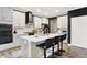 Modern kitchen featuring a center island with bar seating, sleek countertops, and modern appliances at 3592 Gillsland Rd, Bargersville, IN 46106