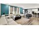 Open-concept living space with stylish sofas, large windows, and a view into the kitchen at 3592 Gillsland Rd, Bargersville, IN 46106