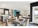 Open living space featuring a dining area, kitchen, and living room, offering seamless flow and modern design at 3592 Gillsland Rd, Bargersville, IN 46106