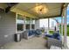 Covered patio with comfortable seating, ceiling lights, and stylish outdoor furniture at 3592 Gillsland Rd, Bargersville, IN 46106