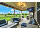 Relax on the covered patio featuring outdoor seating, a fire pit, and a TV for ultimate outdoor entertainment at 3592 Gillsland Rd, Bargersville, IN 46106