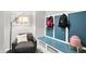 Comfortable sitting area with a cushioned chair and stylish mudroom-style storage and decor at 3592 Gillsland Rd, Bargersville, IN 46106