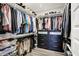 Organized walk-in closet with shelving, drawers, and racks for clothing storage at 3592 Gillsland Rd, Bargersville, IN 46106