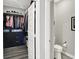 Well-organized walk-in closet with built in shelving, drawer units and racks at 3592 Gillsland Rd, Bargersville, IN 46106