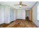 Bedroom featuring wood floors, wallpaper, a ceiling fan, and natural light at 3642 S Mauxferry Rd, Franklin, IN 46131