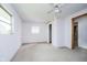 Bright bedroom with white walls, carpet, ceiling fan, natural light, and closet at 3642 S Mauxferry Rd, Franklin, IN 46131