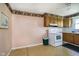 Functional kitchen with range, wallpaper, ample cabinet space at 3642 S Mauxferry Rd, Franklin, IN 46131
