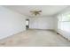 Bright living room featuring neutral walls, carpet and a ceiling fan at 3642 S Mauxferry Rd, Franklin, IN 46131