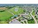 Stunning aerial view of community golf course, clubhouse, pool, and tennis courts at 3832 Boundary Bay Dr, Indianapolis, IN 46217