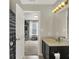 Bathroom features a vanity and view into an adjacent room with window at 3832 Boundary Bay Dr, Indianapolis, IN 46217