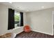 Cozy bonus room with a beanbag chair and dark wood floors creating a casual space at 3832 Boundary Bay Dr, Indianapolis, IN 46217