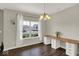 Dining room featuring an accent light fixture, white curtains, and spacious butcher block countertop workspace at 3832 Boundary Bay Dr, Indianapolis, IN 46217