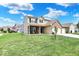 Two-story home with neutral siding, a brick facade, attached two-car garage, and well-manicured lawn at 3832 Boundary Bay Dr, Indianapolis, IN 46217