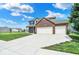 Spacious two-story home with brick accents, a two-car garage, and a large driveway at 3832 Boundary Bay Dr, Indianapolis, IN 46217
