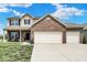 Inviting two-story home boasting a brick front, attached two-car garage, and manicured front lawn at 3832 Boundary Bay Dr, Indianapolis, IN 46217