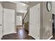 Inviting foyer with dark wood floors, staircase, and entry to the living areas at 3832 Boundary Bay Dr, Indianapolis, IN 46217