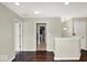 Bright hallway with dark wood floors and white trim offers a clean and welcoming transition space at 3832 Boundary Bay Dr, Indianapolis, IN 46217