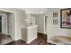Upper-level hallway with hardwood floors and neutral walls, connecting various rooms in the house at 3832 Boundary Bay Dr, Indianapolis, IN 46217