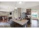 Open kitchen flows into the living area with dark cabinets, stainless steel appliances, and island seating at 3832 Boundary Bay Dr, Indianapolis, IN 46217