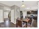 Open concept showing kitchen with island, stainless appliances, dark cabinets, and adjoining dining area at 3832 Boundary Bay Dr, Indianapolis, IN 46217