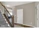 Carpeted staircase with dark wood banister leading to the upper level of the home at 3832 Boundary Bay Dr, Indianapolis, IN 46217