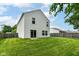 Lush green backyard with a well-maintained lawn and privacy fence at 3839 Churchman Woods Blvd, Indianapolis, IN 46203