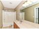 Bathroom featuring a shower with a curtain, a vanity with a large mirror, and neutral walls at 3839 Churchman Woods Blvd, Indianapolis, IN 46203