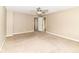 Carpeted bedroom with neutral walls and views to bathroom and closet at 3839 Churchman Woods Blvd, Indianapolis, IN 46203