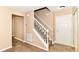 Inviting foyer featuring a staircase with white railing and neutral wall colors at 3839 Churchman Woods Blvd, Indianapolis, IN 46203