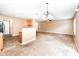 Spacious open living room area with views of the kitchen, dining, and stairs at 3839 Churchman Woods Blvd, Indianapolis, IN 46203