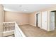 The spacious loft area offers flexibility, perfect as a playroom or office, enhancing home versatility at 3839 Churchman Woods Blvd, Indianapolis, IN 46203