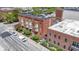 Brick apartment building with bay windows, professional landscaping, and a view of the city at 404 E New York E St # 406, Indianapolis, IN 46202