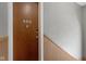 Apartment door with modern lock on grey walls with wooden trim at 404 E New York E St # 406, Indianapolis, IN 46202