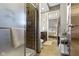 Bathroom with a tiled shower, and a view into the vanity area and bedroom at 404 E New York E St # 406, Indianapolis, IN 46202