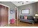 Bedroom with hardwood floors, a ceiling fan, and a comfortable futon couch at 404 E New York E St # 406, Indianapolis, IN 46202