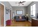 Bedroom with hardwood floors, a ceiling fan, and a comfortable futon couch at 404 E New York E St # 406, Indianapolis, IN 46202