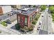 Detailed aerial shot showcasing the building's facade, parking lot, and street view at 404 E New York E St # 406, Indianapolis, IN 46202
