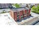 Overhead shot showing the building's design, balcony details, and surrounding urban landscape at 404 E New York E St # 406, Indianapolis, IN 46202