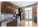Well-equipped kitchen with stainless steel appliances and access to an outdoor balcony at 404 E New York E St # 406, Indianapolis, IN 46202