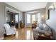 Bright living room boasts a bay window, hardwood floors, and cozy seating arrangements at 404 E New York E St # 406, Indianapolis, IN 46202