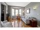 Comfortable living room featuring hardwood floors, a bay window, and contemporary decor at 404 E New York E St # 406, Indianapolis, IN 46202