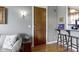Cozy living room with hardwood floors, neutral gray walls, and a view of kitchen at 404 E New York E St # 406, Indianapolis, IN 46202