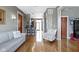 Open-concept living area features hardwood floors and a breakfast bar leading to the kitchen at 404 E New York E St # 406, Indianapolis, IN 46202