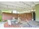 Covered patio with outdoor seating and a hot tub, ideal for relaxation and entertaining at 4163 Otterbein Ave, Indianapolis, IN 46227