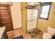 Bathroom featuring a glass-doored shower, tiled floor, and classic fixtures at 4163 Otterbein Ave, Indianapolis, IN 46227
